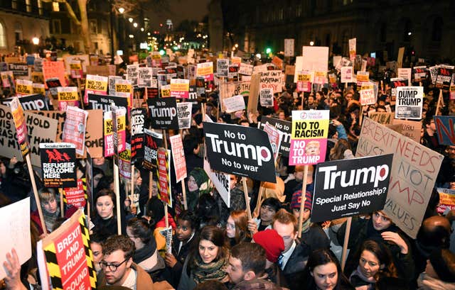 People demonstrate during a protest at Downing Street in central London against US President Donald Trump's controversial travel ban on refugees and people from seven mainly-Muslim countries. (Victoria Jones/PA)