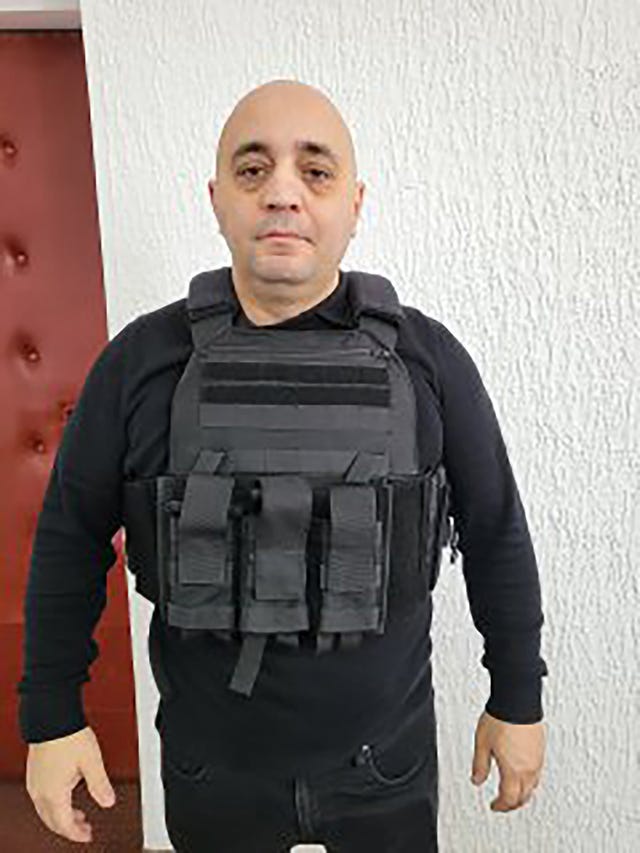 Biser Dzhambazov, who posed as an Interpol ageny, wearing a protective vest