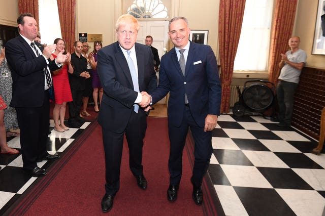 Dominic Cummings (right) applauding as Prime Minister Boris Johnson shakes hands with Sir Mark Sedwill (second right) when the new PM arrived in Downing Street (Stefan Rousseau/PA)