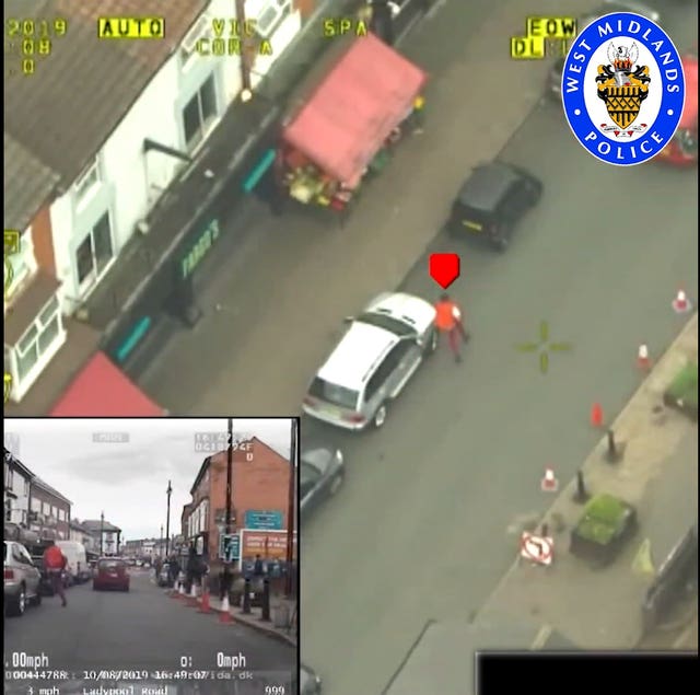 Videograb of police helicopter footage issued by West Midlands Police of Mubashar Hussain on the run after knocking down Pc Gareth Phillips in a hijacked police BMW and driving away at up to 97mph