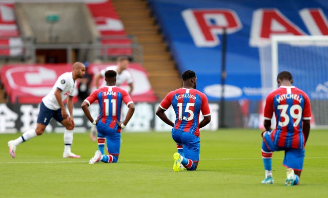 Crystal Palace players take the knee during a match against Tottenham