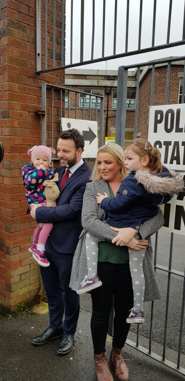 Colum Eastwood with his family after voting at Model Primary School in Londonderry