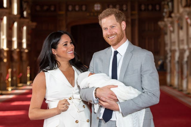 Harry and Meghan with their baby son