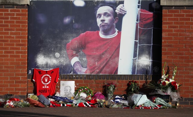 Tributes were laid outside Old Trafford before the funeral service took place