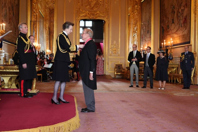 Mr Taylor being formally made a CBE