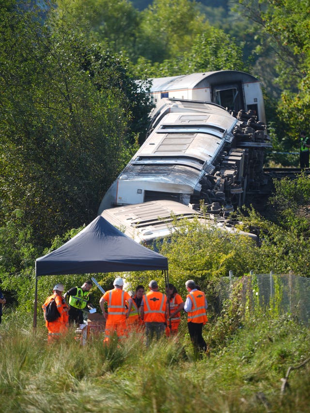 Rail staff at the scene of the train derailment