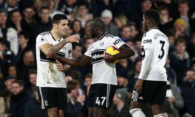 Kamara argues with Aleksandar Mitrovic, left, before taking the penalty (Yui Mok/PA Images)