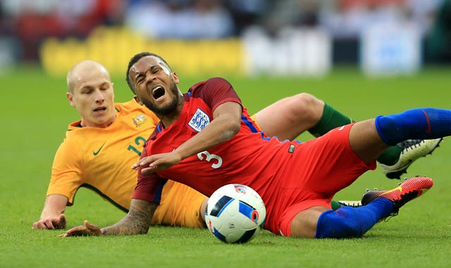 Aaron Mooy, left, was spotted by Bella playing for Australia at last summer's World Cup