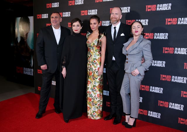 Graham King, Kristin Scott Thomas, Alicia Vikander, Roar Uthaug and Jaime Winstone on the red carpet in Leicester Square (Isabel Infantes/PA)