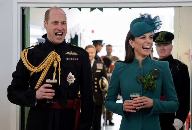 The Prince and Princess of Wales laugh and enjoy a glass of Guinness during a visit to the 1st Battalion Irish Guards for the St Patrick’s Day Parade, at Mons Barracks in Aldershot