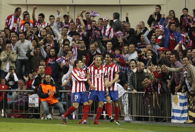 Diego Forlan, centre, starred against Liverpool in 2010