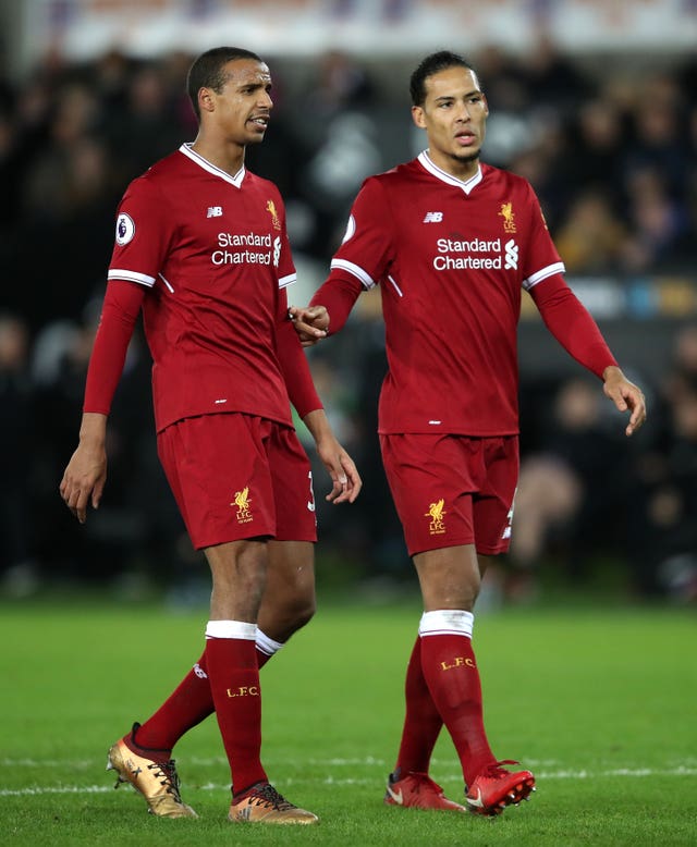 Joel Matip, left, and Virgil Van Dijk helped keep Robert Lewandowski under wraps 