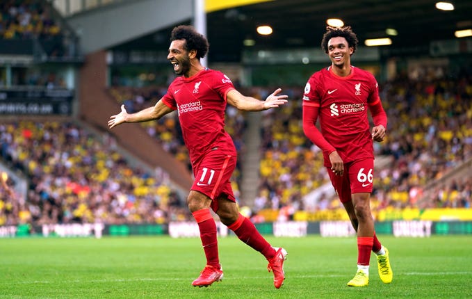 Mohamed Salah, left, celebrates a goal with Trent Alexander-Arnold