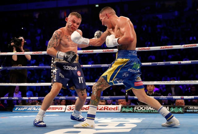 Josh Warrington, right, prevailed after a bruising battle against Carl Frampton (Martin Rickett/PA)