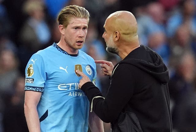 Manchester City manager Pep Guardiola, right, gives instructions to Kevin De Bruyne during the win over Bournemouth