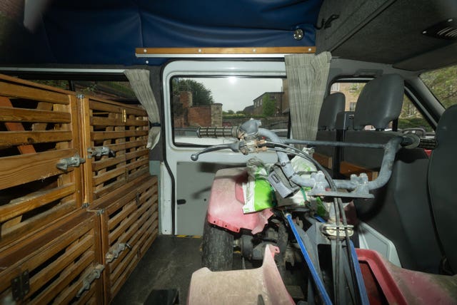 Dog crates and a homemade sled inside the van belonging to Vince King and Karen Alcock (Joe Giddens/PA)
