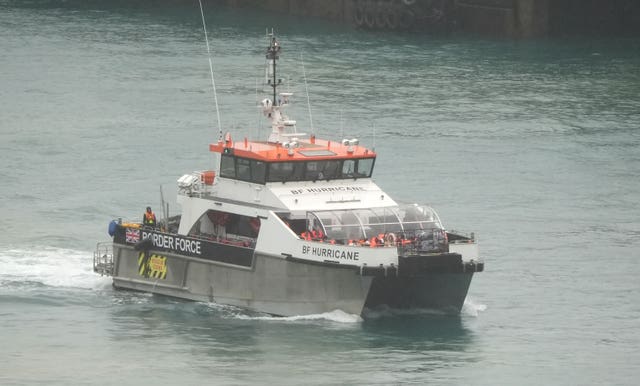 A group of people thought to be migrants are brought in to Dover