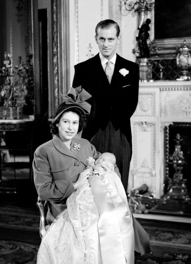 The Duke of Edinburgh and Princess Elizabeth with their son Prince Charles after his christening ceremony (PA)