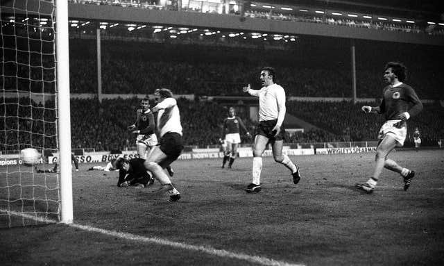 Francis Lee (centre) scores for England against West Germany