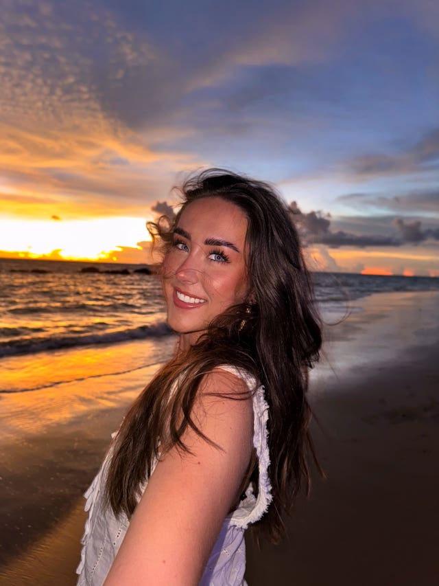 Maya Lind on a beach