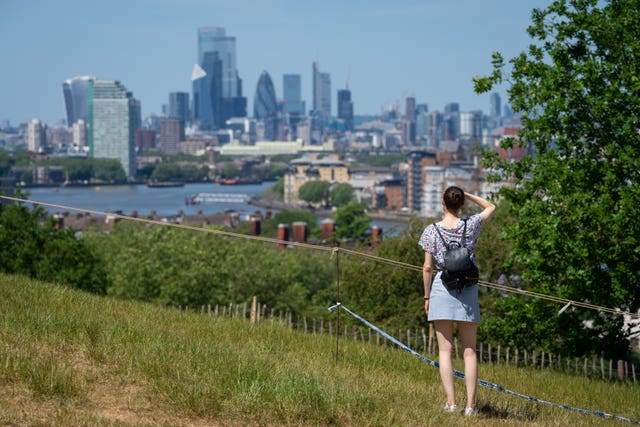 People enjoy the hot weather in Greenwich Park, London (Dominic Lipinski/PA Wire)