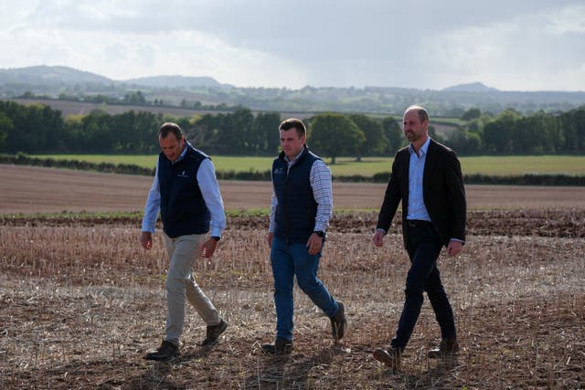 The Prince of Wales, in his role as the Duke of Cornwall, during a visit to Monkhall Farm in Hereford, to meet 25-year-old Harry Davies (centre), the incoming tenant of the Duchy of Cornwall’s first regenerative Farm Business Tenancy