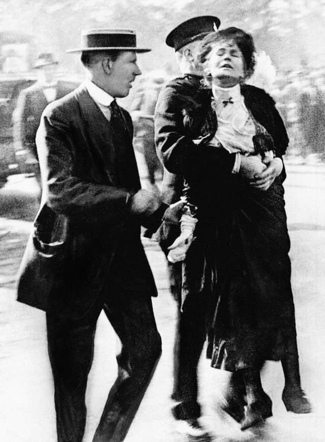 Emmeline Pankhurst, one of the founding members of the Women’s Social and Political Union, being arrested by police outside Buckingham Palace in 1914 , while trying to present a petition to George V (PA)