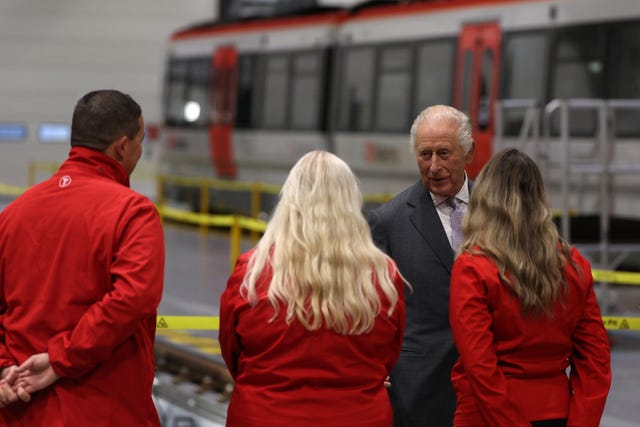 The King speaking to Transport for Wales apprentices during his visit to the South Wales Metro depot
