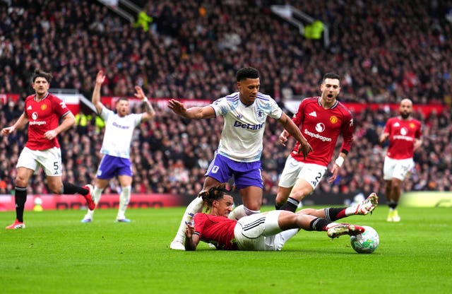 Leny Yoro (left) denies Ollie Watkins