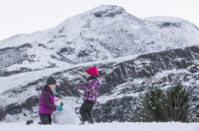 Children play in snow