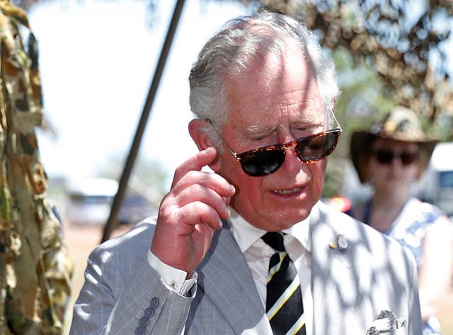 The Prince of Wales adjusts his sunglasses during a visit to NORFORCE to learn about the Australian Army’s Regional Force Surveillance Unit (Phil Noble/PA)