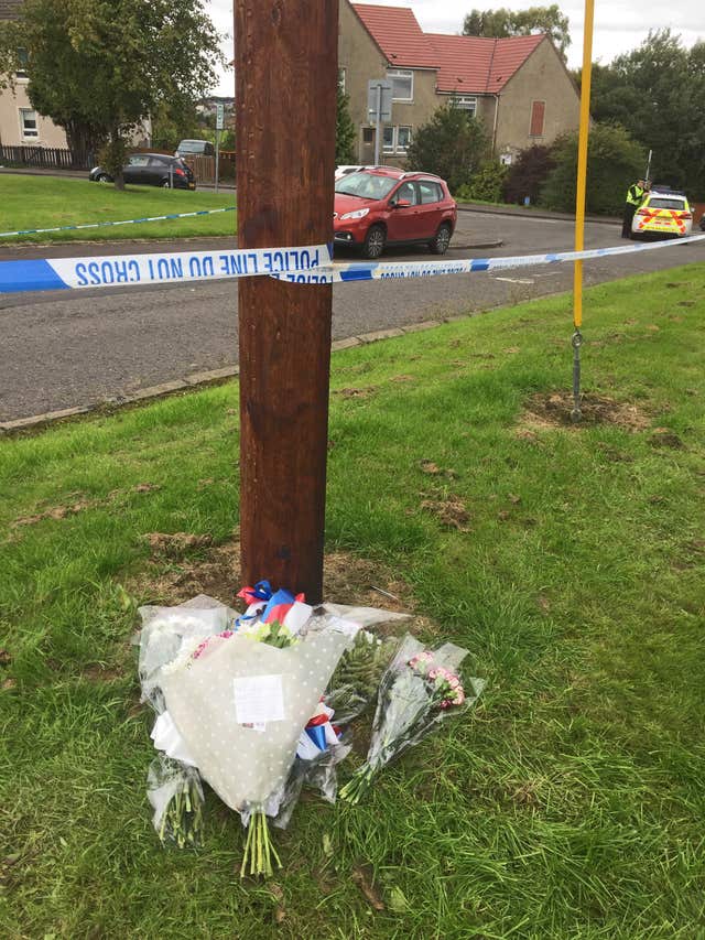 Flowers left at scene of shooting