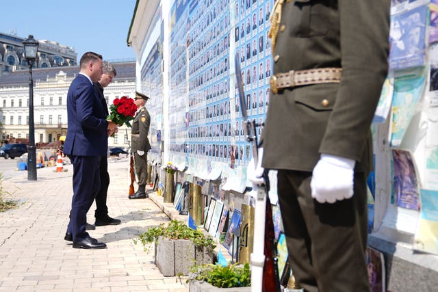 Defence Secretary Wes Streeting (right) and Ukrainian deputy defence minister Serhiy Boyve lay flowers at the Wall of Remembrance in Kyiv