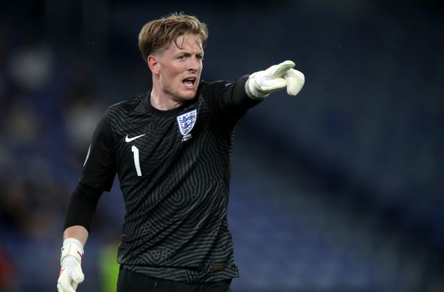 England goalkeeper Jordan Pickford points