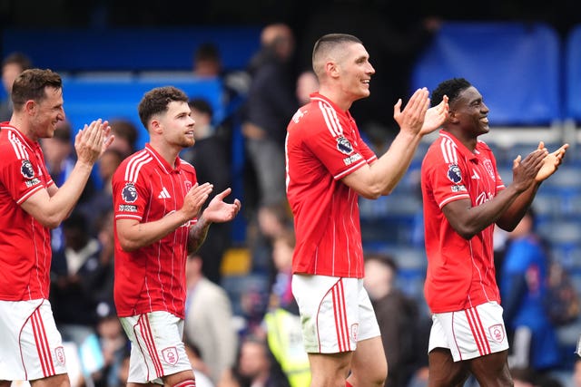 Nottingham Forest players applaud the fans following victory at Chelsea