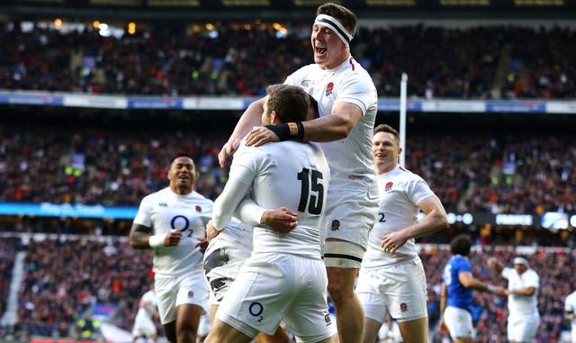 England celebrate their first try of the game