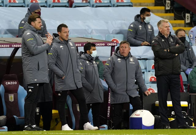 Aston Villa manager Dean Smith (right) and his coaching staff will not present for the third-round clash