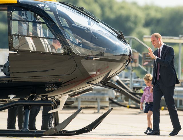 Royal duties can be fun as George found out when he had a play in a helicopter in Germany (Dominic Lipinski/PA)