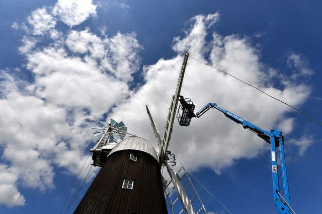 A new sail is fitted to the windmill (Joe Giddens/PA)