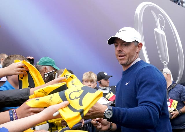 Rory McIlroy signs autographs