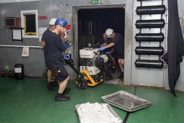 Suspected drugs being loaded onto support ship RFA Argus in the Caribbean Sea