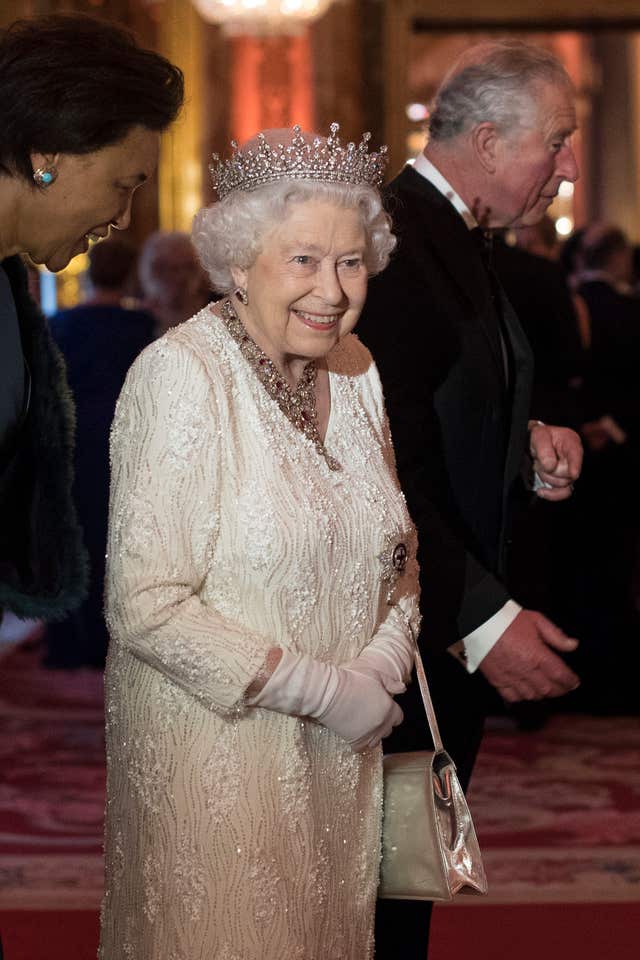 The Queen greets guests as she hosts a dinner during the Commonwealth Heads of Government Meeting (Victoria Jones/PA)