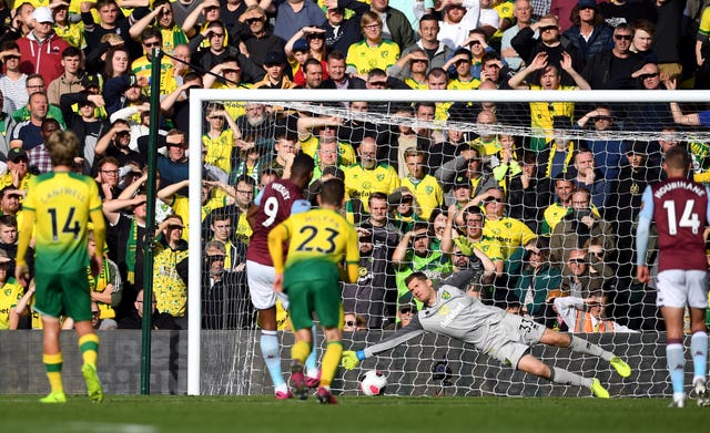 Wesley sees his penalty saved by goalkeeper Michael McGovern