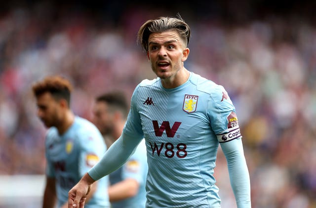 Jack Grealish reacts after being booked for diving