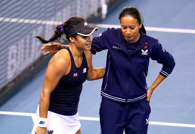 Heather Watson (left) is consoled by captain Anne Keothavong after losing to Storm Sanders