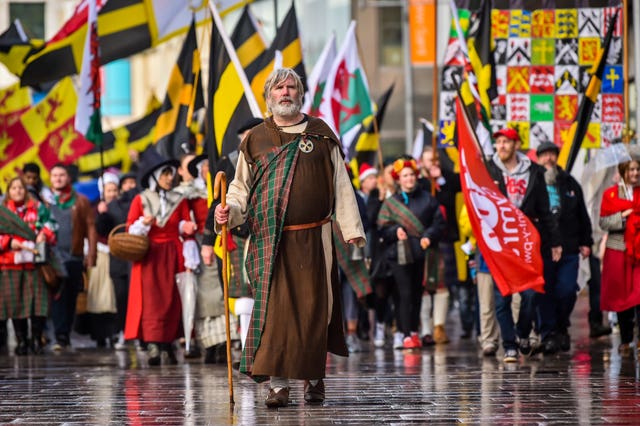 A man dressed as Dewi Sant led the parade