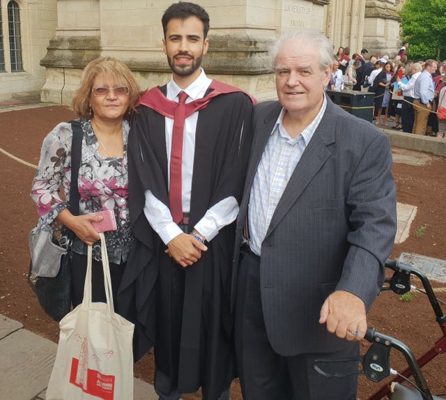 Tim Roberts with his parents