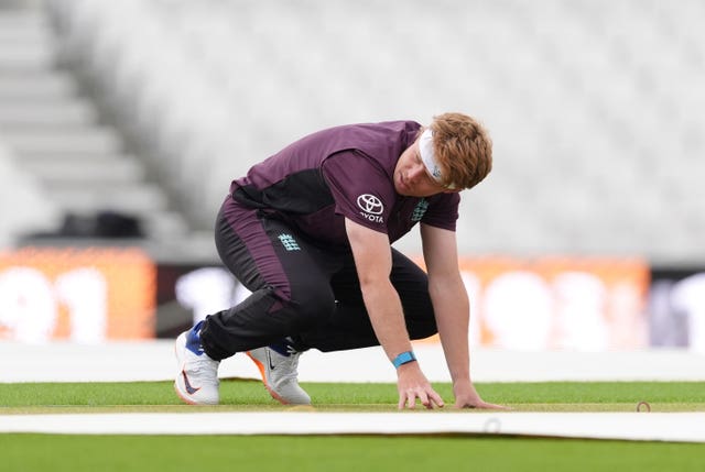 Ollie Pope assesses the pitch at the Oval ahead of England's fifth Test against India.