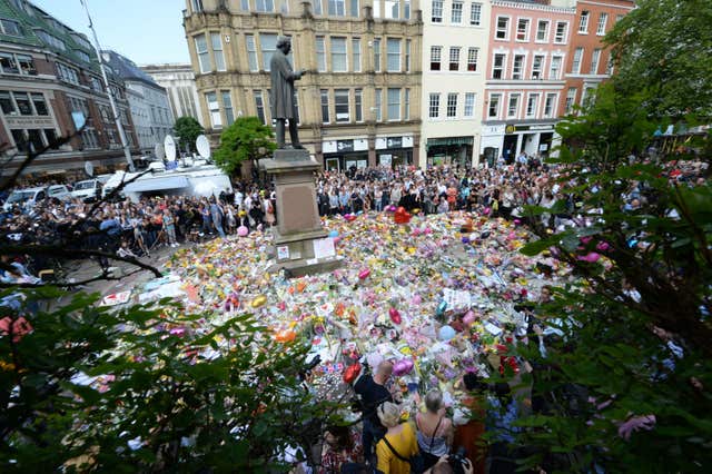 Floral tributes to victims of the Manchester bombing (Ben Birchall/PA)