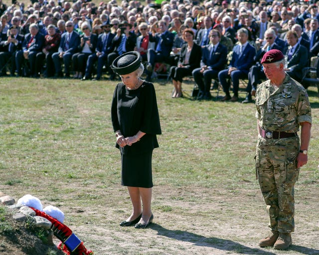 Prince Charles attends a commemorative service and wreath-laying with Princess Beatrix of The Netherlands